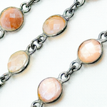 Load image into Gallery viewer, Coated Peach Moonstone Round Shape Bezel Oxidized Wire Chain.