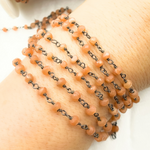 Load image into Gallery viewer, Peach Moonstone Wire Wrap Chain made with Black Rhodium Plate 925 Sterling Silver