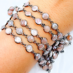 Load image into Gallery viewer, Coated Peach Moonstone Round Shape Bezel Oxidized Wire Chain.