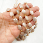 Load image into Gallery viewer, Coated Peach Oval Moonstone Gold Plated Wire Chain.
