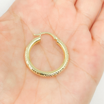 Load image into Gallery viewer, 14K Gold Hoop Earrings with Engraved Tornado Design.