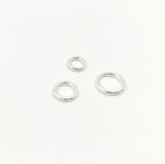 Load image into Gallery viewer, Sterling Silver Open Jump Rings 18 Gauge 7mm. 5004524
