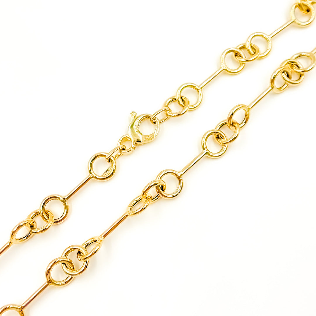 568/A080. 14K Solid Gold Hollow Bar and Rings Necklace