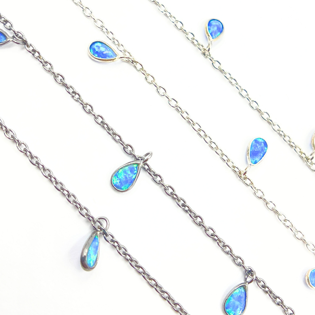 Created Blue Opal Tear Drop Shape Dangle Chain.