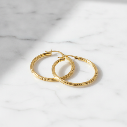 GER173. 14K Gold Hollow Hoop Earrings with Engraved Tornado Design