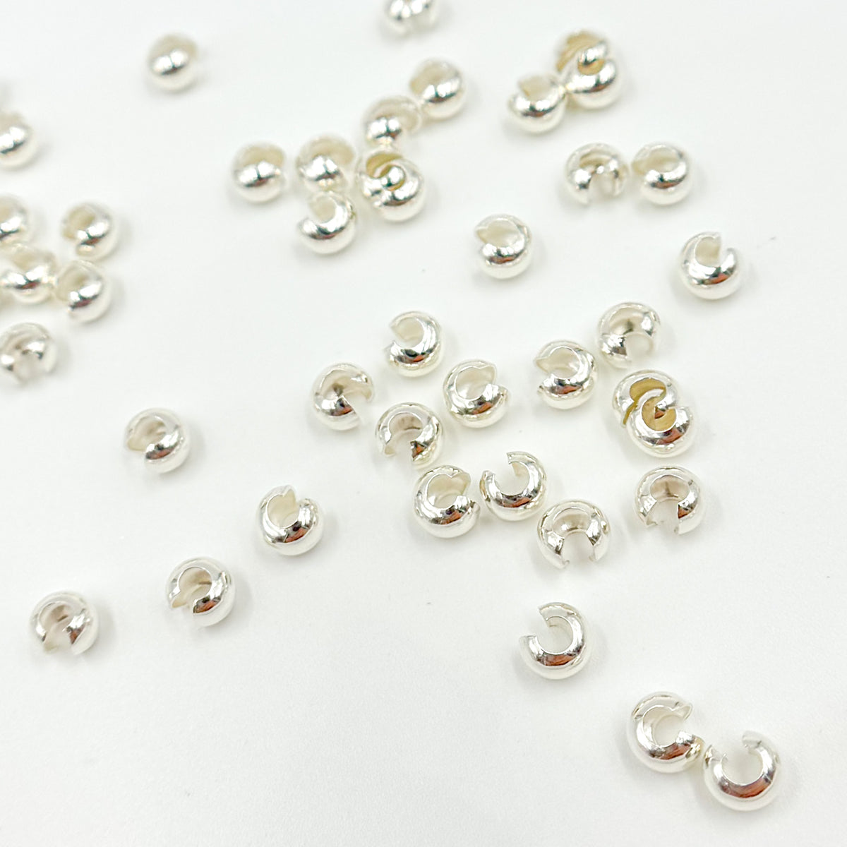 5004840CC. White Sterling Silver Crimp Cover. Size: 4mm. Sold by Package of 50 or 100 Pcs.