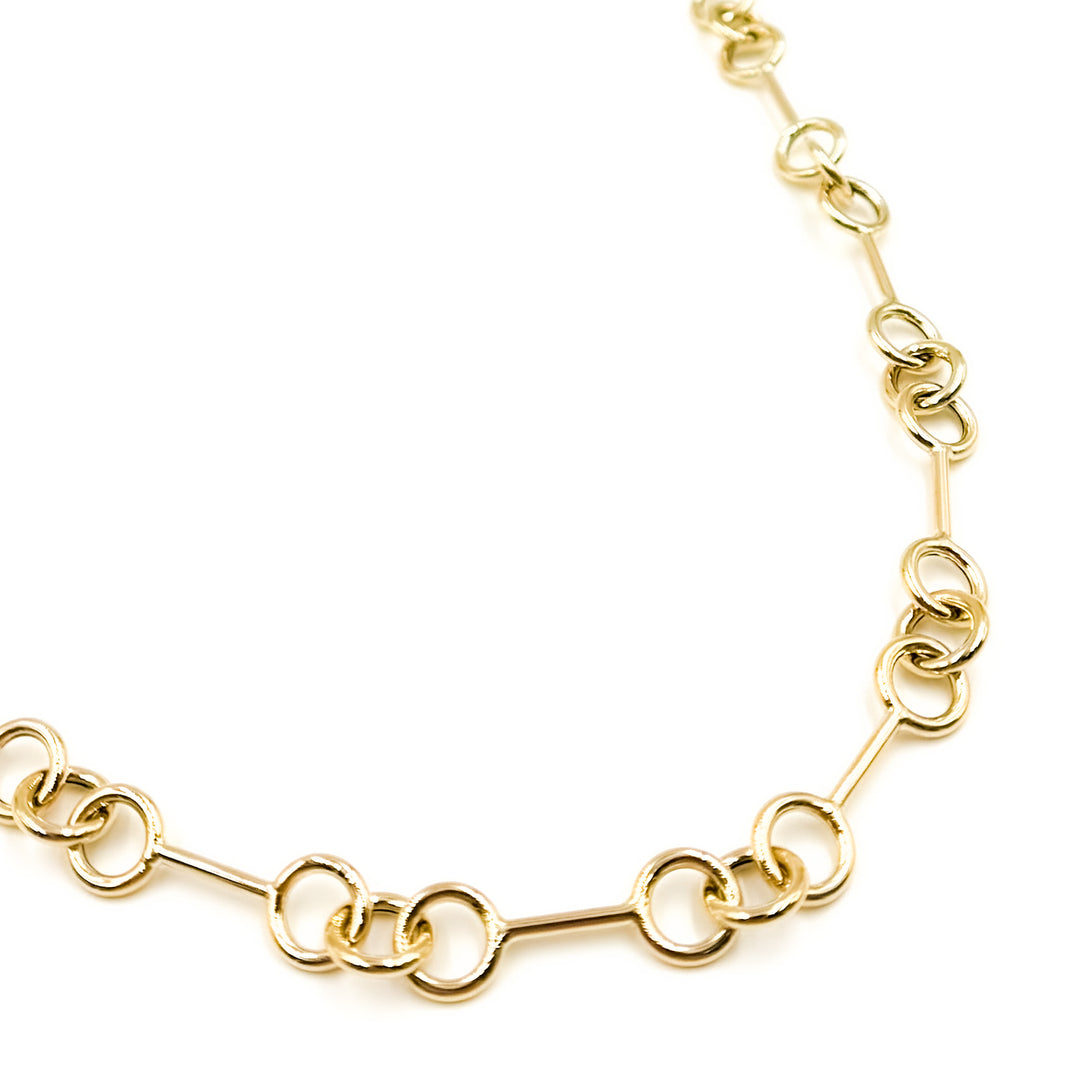 568/A080. 14K Solid Gold Hollow Bar and Rings Necklace