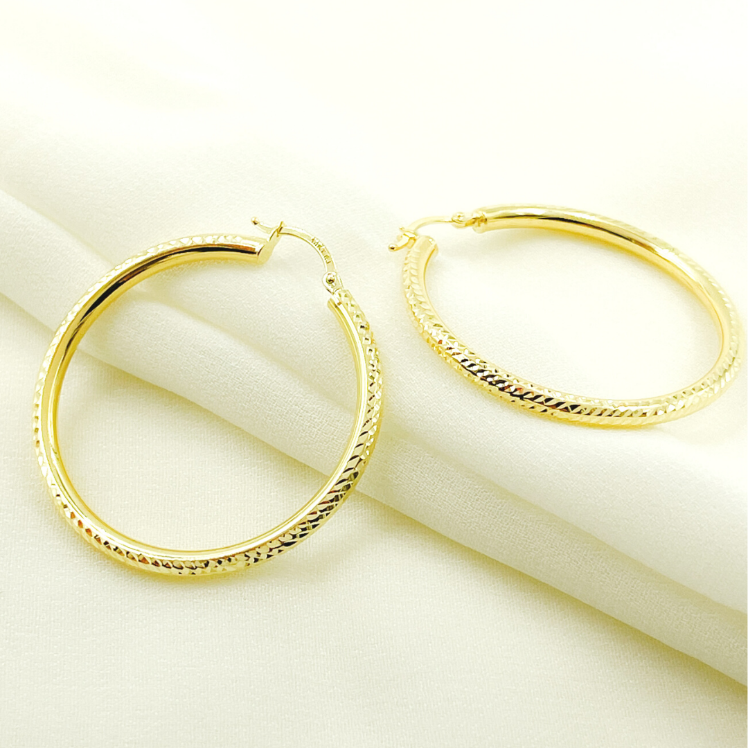 14K Gold Hoop Earrings with Engraved Tornado Design. 
