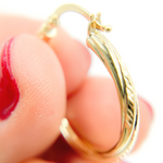 Load image into Gallery viewer, 14K Gold Hoop Earrings with Engraved Tornado Design. 