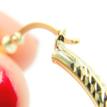 Load image into Gallery viewer, 14K Gold Hoop Earrings with Engraved Tornado Design.