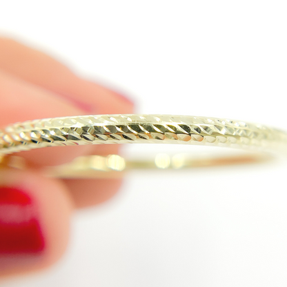 14K Gold Hoop Earrings with Engraved Tornado Design. 