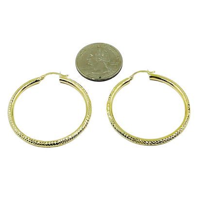 14K Gold Hoop Earrings with Engraved Tornado Design. 